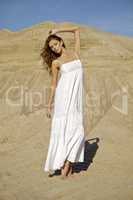 attractive and sensuality woman dancing in the desert