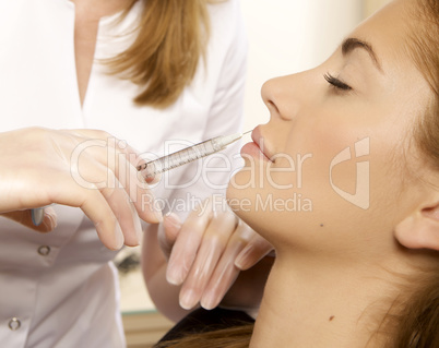 young beautiful woman having an injection