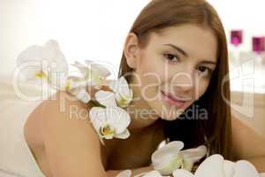 Beautiful young woman with lily flower