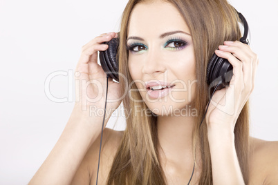 Beautiful girl is listen to the music