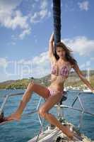 pretty young woman posing on the yacht