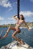 pretty young woman posing on the yacht