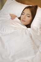 Woman lying in bed sleeping