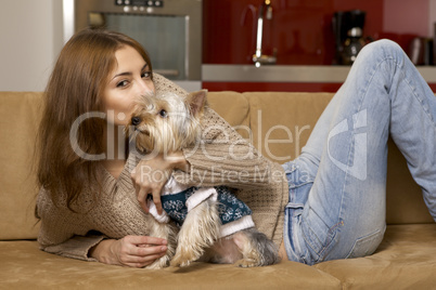 Cute young girl with her Yorkie puppy