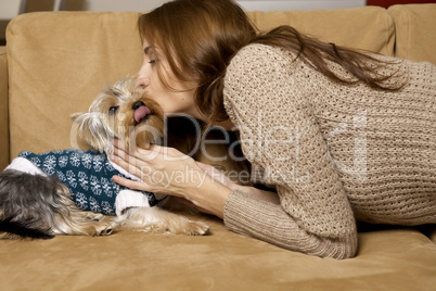 Cute young girl with her Yorkie puppy