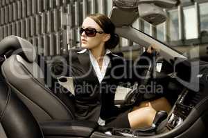 businesswoman driving a car