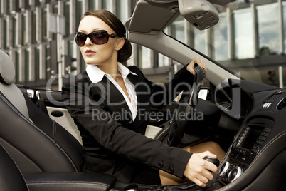 businesswoman driving a car