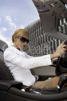 blonde businesswoman in a car