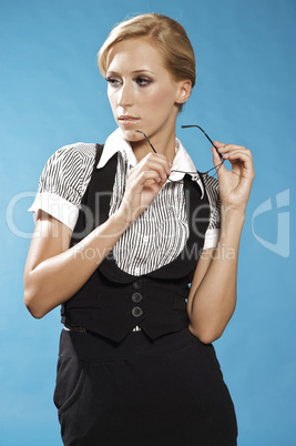 Businness woman portrait, holding a glasses.