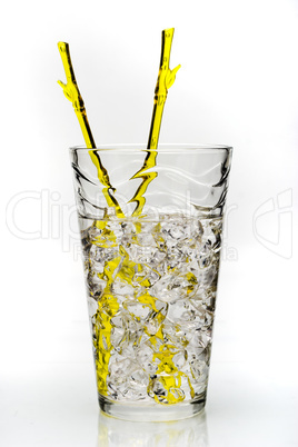 drink with ice and yellow stirring rod