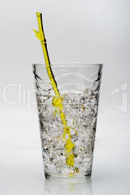 drink with ice and yellow stirring rod