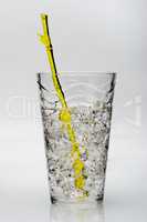 drink with ice and yellow stirring rod