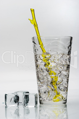 drink with ice and yellow stirring rod