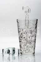 glass with ice and ice cubes
