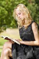 Young woman reading book