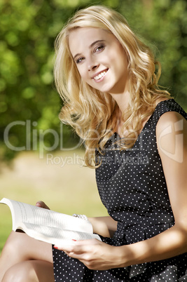 Young woman reading book