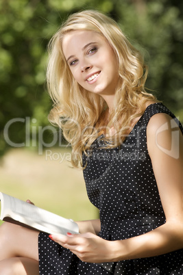 Young woman reading book