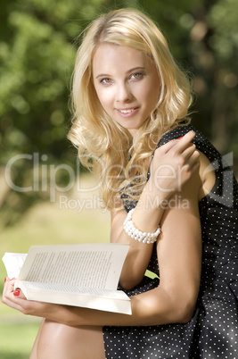 Young woman reading book