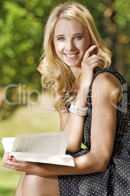 Young woman reading book