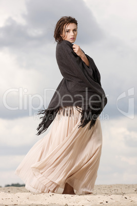 attractive and sensuality woman dancing in the desert