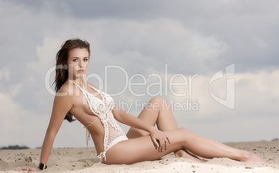 young fashion pretty sexy woman on the beach