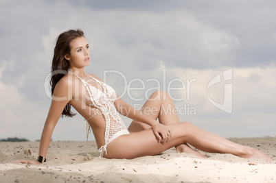 young fashion pretty sexy woman on the beach