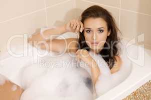 Woman in bath relaxing. Closeup of young woman in bathtub bathin