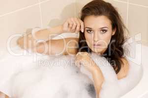 Woman in bath relaxing. Closeup of young woman in bathtub bathin