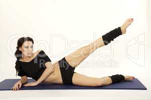 Beautiful sporty woman in black dress slim body