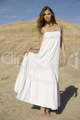 attractive and sensuality woman dancing in the desert