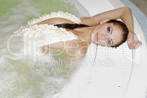 Young beautiful woman in jacuzzi