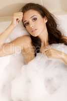 Woman in bath relaxing. Closeup of young woman in bathtub bathin