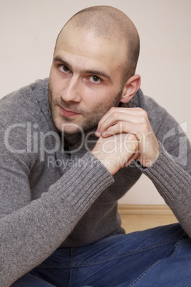 fashion portrait of handsome young man in a sweater