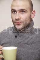 fashion portrait of handsome young man in a sweater