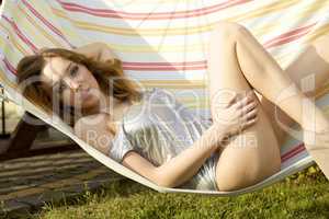 Beautiful woman lying in hammock