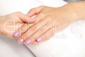 Manicure - Beautiful manicured woman's nails with violet nail po