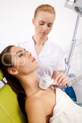 Young woman receiving laser therapy