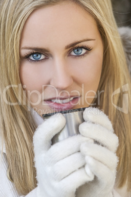 Blond Woman In Gloves Drinking Warm Drink