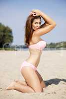 beautiful brunette woman in pink bikini