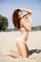beautiful brunette woman in pink bikini