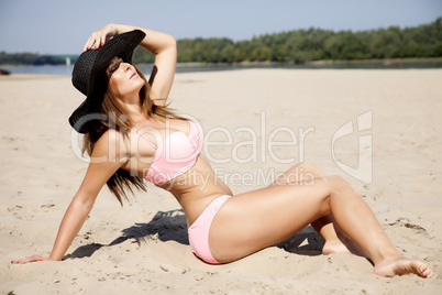 beautiful brunette woman in pink bikini