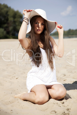 beautiful brunette woman in white dress