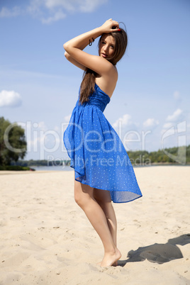 beautiful brunette woman in blue dress