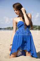 beautiful brunette woman in blue dress