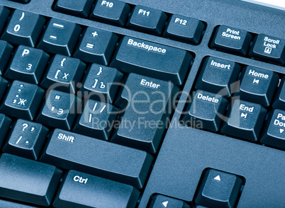 Electronic collection - black computer keyboard. The focus on th