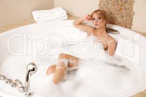 Woman in bath relaxing. Closeup of young woman in bathtub bathin