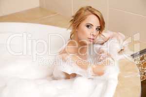 Woman in bath relaxing. Closeup of young woman in bathtub bathin