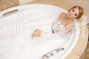 Woman in bath relaxing. Closeup of young woman in bathtub bathin