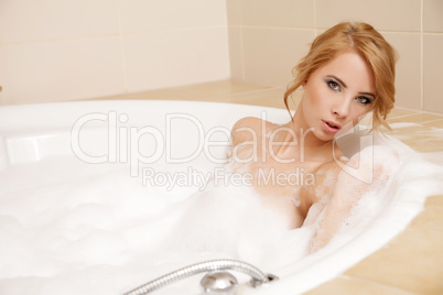 Woman in bath relaxing. Closeup of young woman in bathtub bathin