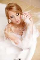 Woman in bath relaxing. Closeup of young woman in bathtub bathin